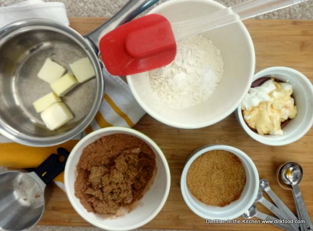 Bowls of measured butter, flour, yogurt, vanilla, cocoa, and brown sugar for making Mexican Chocolate Cookies.