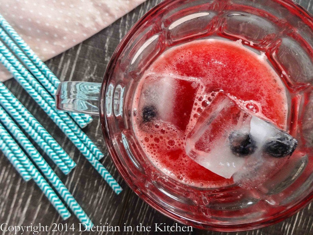 Watermelon Agua Fresca in a glass with ice. 