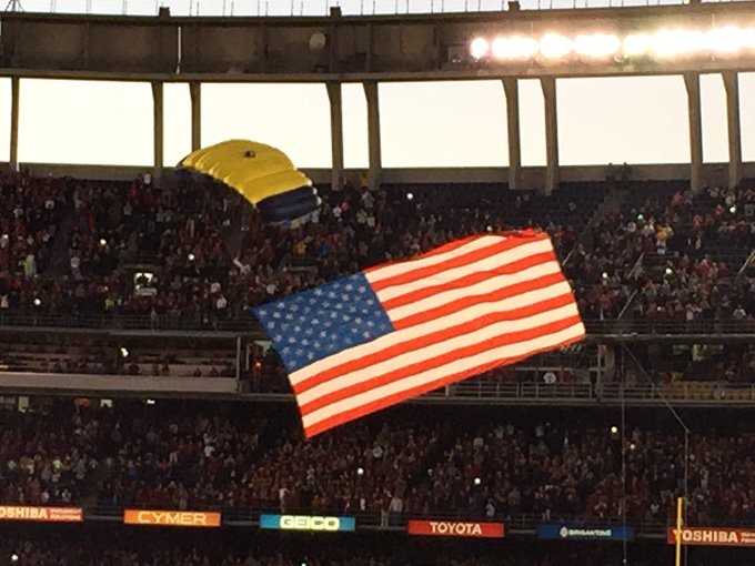 Navy seal that dove out of a plane and parachuted into the stadium!