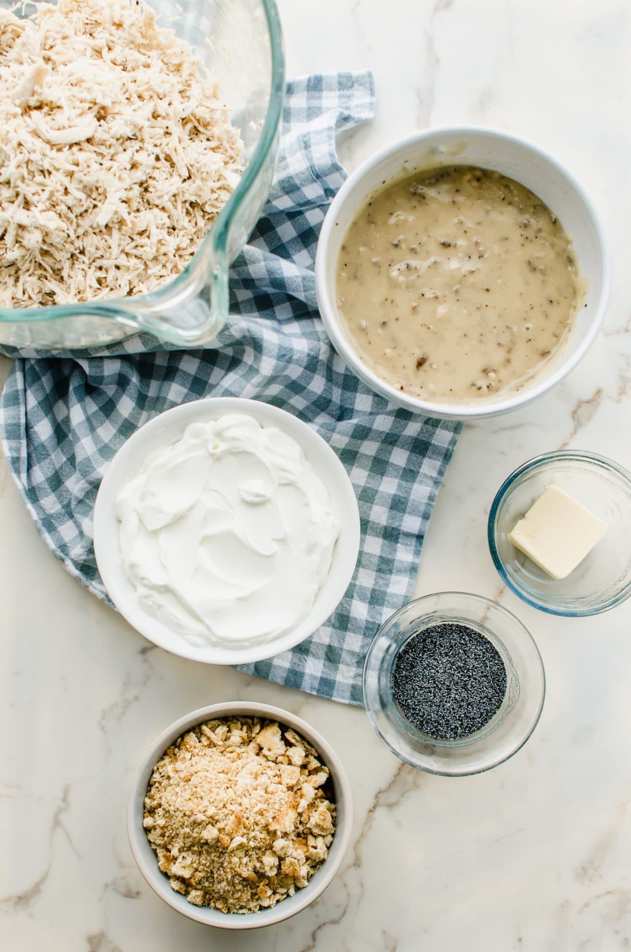 Ingredients for poppy seed chicken measured into bowls.