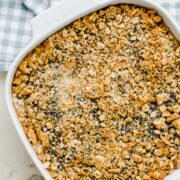 Baked poppy seed chicken casserole in a white baking dish.