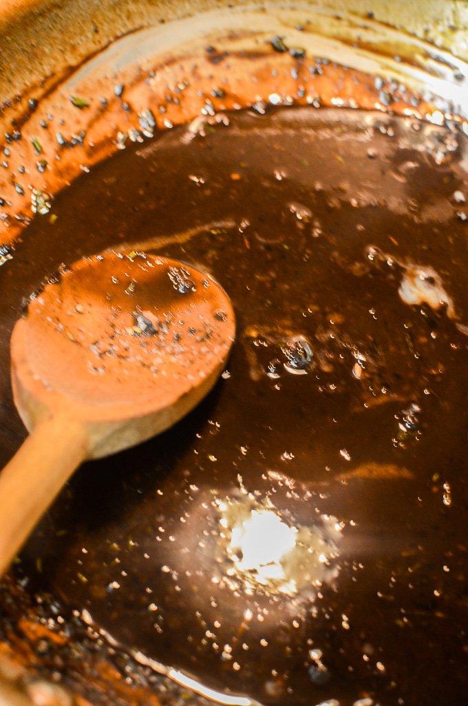 Reducing the liquid into a thick, velvety pan sauce.