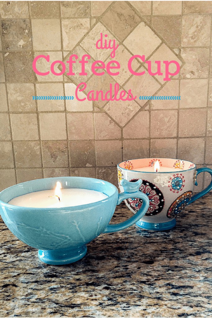 Two lit Coffee Cup Candles sitting on a marble kitchen counter top with, "DIY Coffee Cup Candles" displayed above the candles.