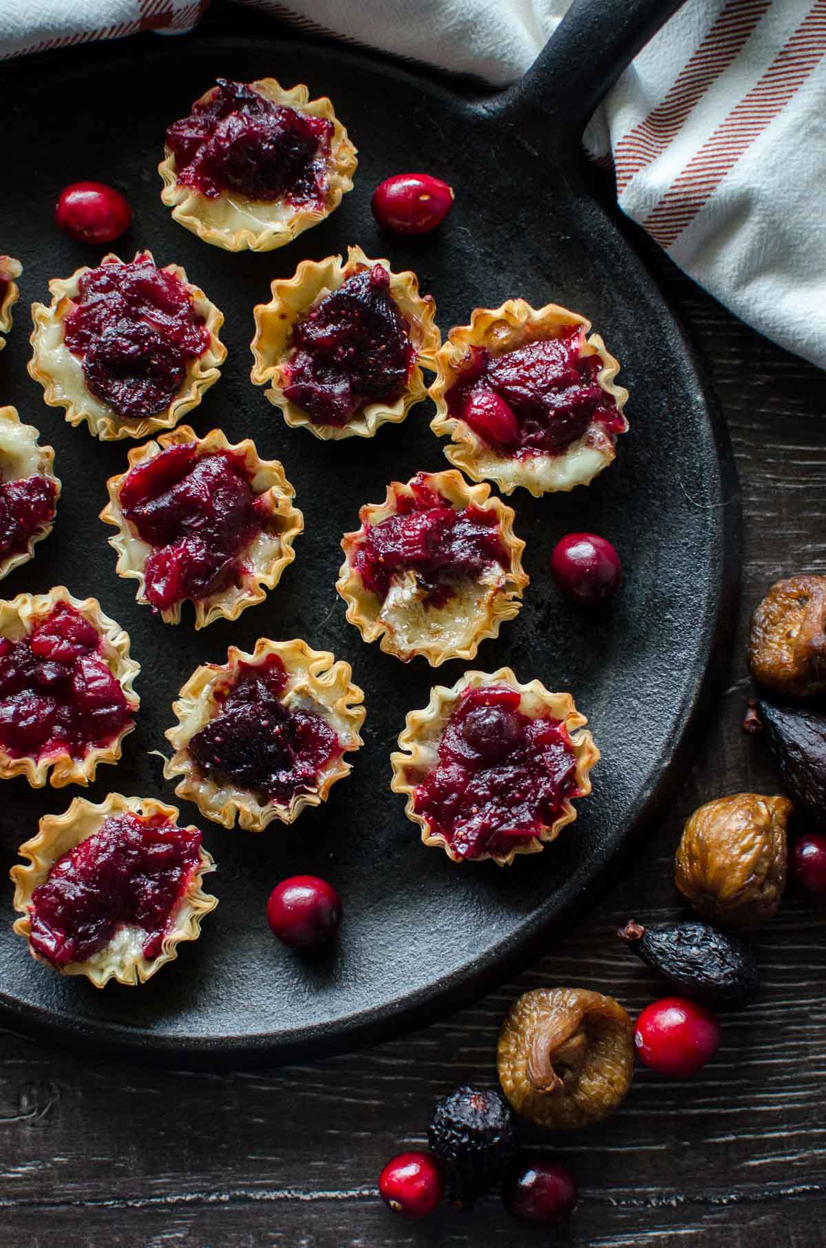 These Fig and Cranberry Brie Tarlets are SO easy to make and are perfect for a stunning, portion-controlled holiday party appetizer!