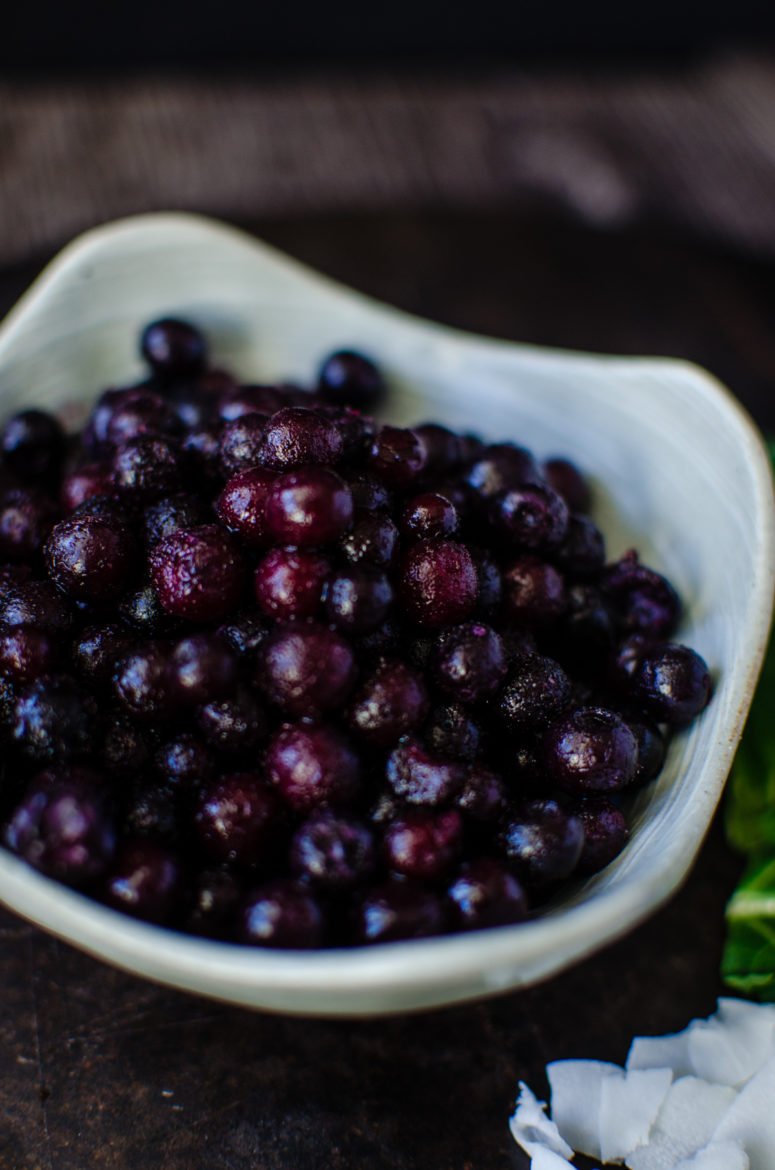 Chocolate Covered Wild Blueberry Superfoods Smoothie is made with highly flavored wild blueberries and packed with nutrition! A chocolate-coconut oil mixture is drizzled into the smoothie and blended, turning it into little chips of chocolate in the smoothie. It's like homemade magic shell in your drink!