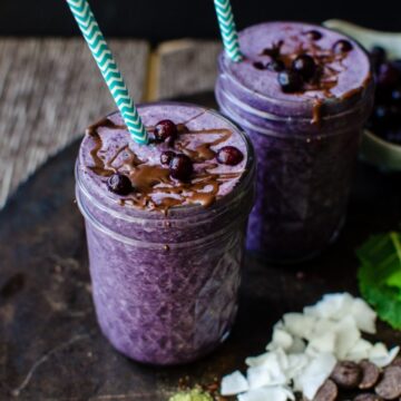 Chocolate Covered Wild Blueberry Superfoods Smoothie is made with highly flavored wild blueberries and packed with nutrition! A chocolate-coconut oil mixture is drizzled into the smoothie and blended, turning it into little chips of chocolate in the smoothie. It's like homemade magic shell in your drink!