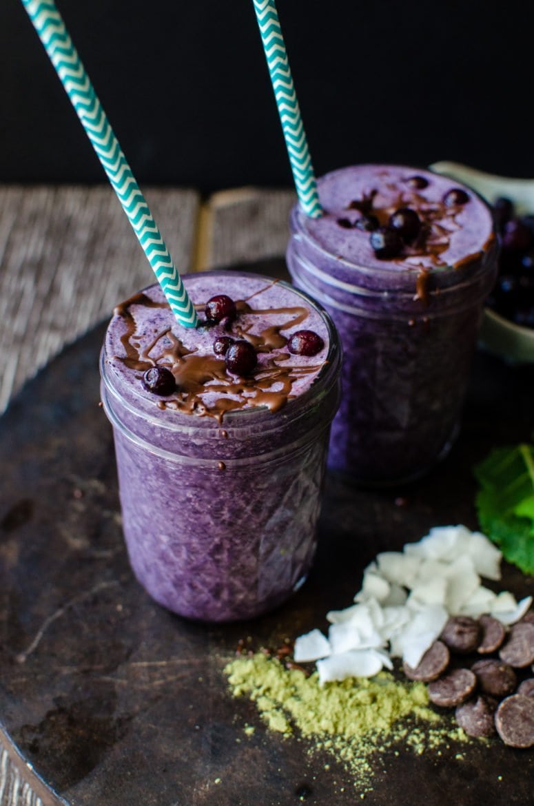 Chocolate Covered Wild Blueberry Superfoods Smoothie is made with highly flavored wild blueberries and packed with nutrition! A chocolate-coconut oil mixture is drizzled into the smoothie and blended, turning it into little chips of chocolate in the smoothie. It's like homemade magic shell in your drink!