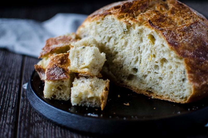 Meyer Lemon Rosemary Bread is an easy bread you can make in a Dutch oven at home. This fragrant bread smells so incredible and looks like it came from a bakery!