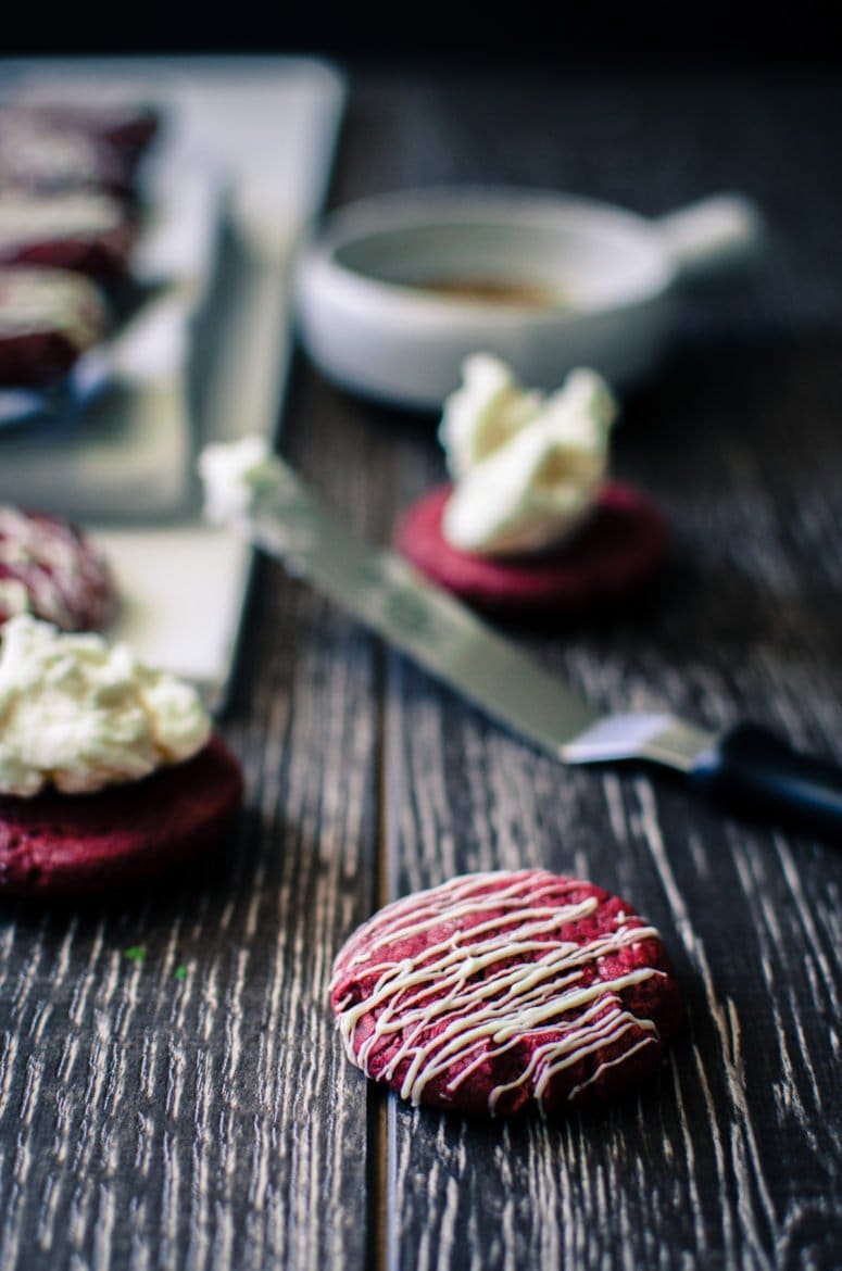 Red Velvet Sandwich Cookies are so easy to make and a great way to use a box of cake mix for a purpose other than cake! There's so many fun flavor combinations you can make with this basic recipe.