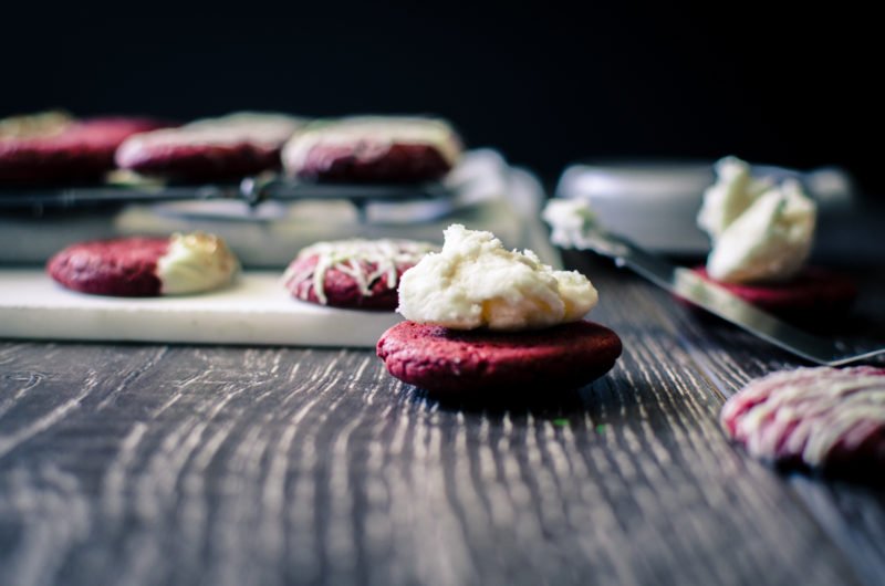 Red Velvet Sandwich Cookies are so easy to make and a great way to use a box of cake mix for a purpose other than cake! There's so many fun flavor combinations you can make with this basic recipe.