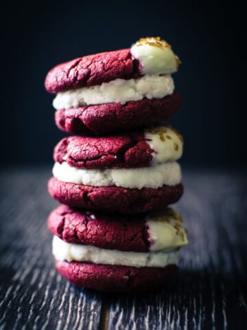 Red Velvet Sandwich Cookies are so easy to make and a great way to use a box of cake mix for a purpose other than cake! There's so many fun flavor combinations you can make with this basic recipe.