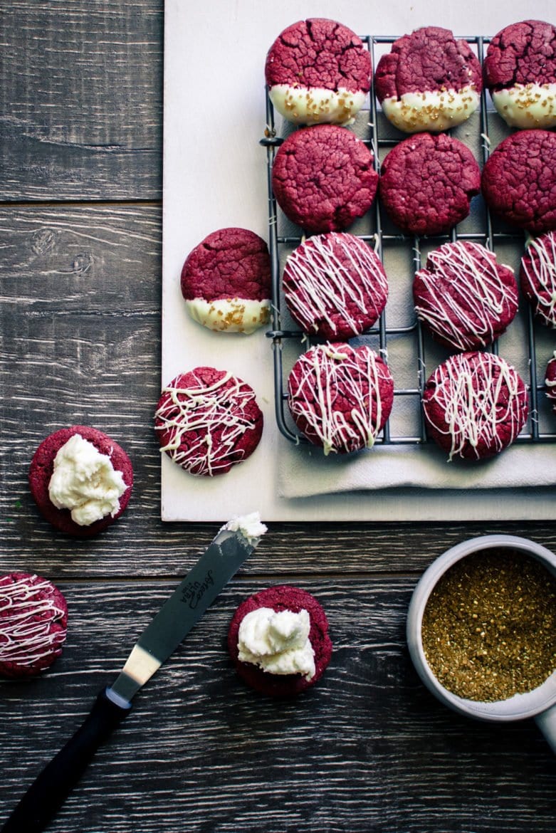 Red Velvet Sandwich Cookies are so easy to make and a great way to use a box of cake mix for a purpose other than cake! There's so many fun flavor combinations you can make with this basic recipe.