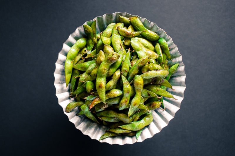 Roasted Edamame with Togarashi and Smoked Sea Salt is an easy appetizer with only 5 ingredients that comes together in under 15 minutes! It's gluten free, low calorie, and mind-blowingly delicious!