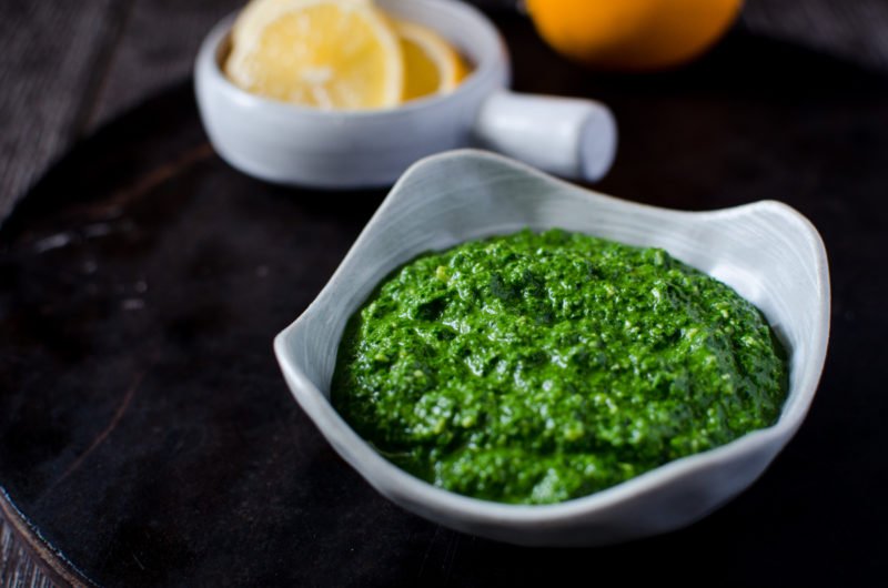 Kale Pesto is an easy, fresh condiment you can make at home that adds a bright cheery flavor to pastas, salad, sandwiches, dips and soups!