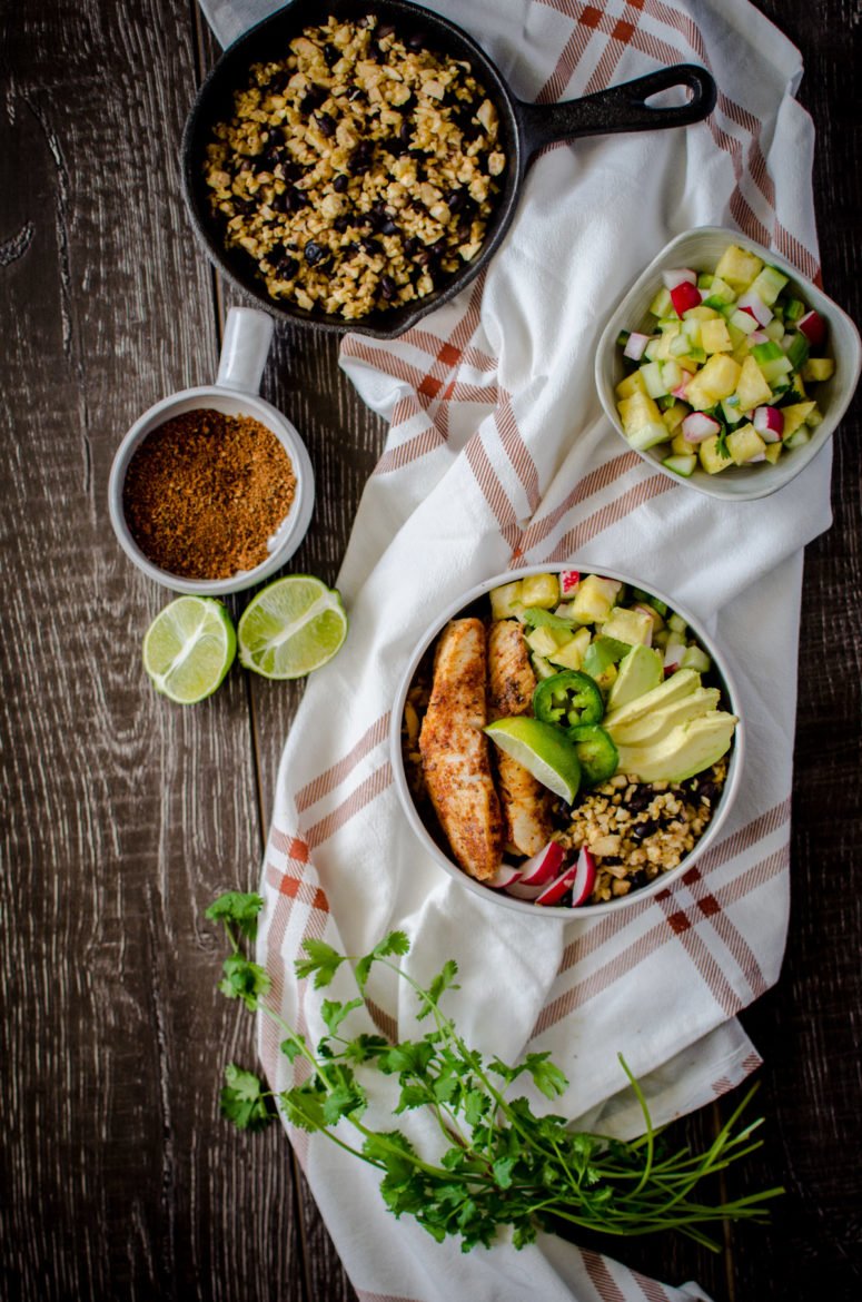 If you like "bowl food," you'll love this fresh and flavorful taco bowls with spicy pan-seared fish, plantain fried rice, black beans, and a juicy pineapple salsa! A fun take on an easy fish taco recipe. 