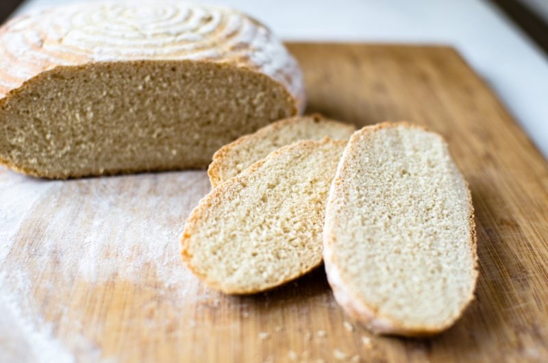 Sliced sourdough bread on a cutting board. 