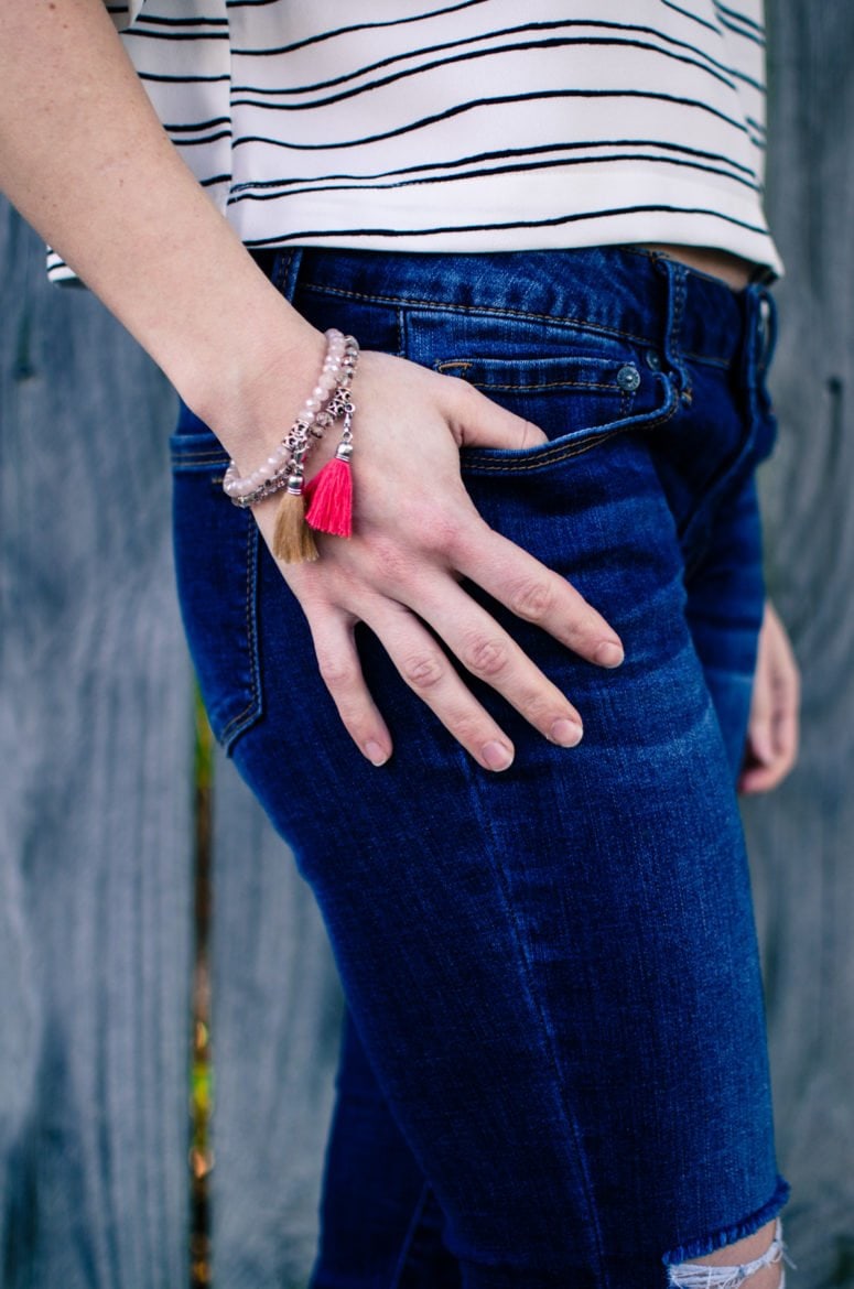 Cropped striped blouse from Who What Wear collection at Target with distressed denim and tassel jewelry. 