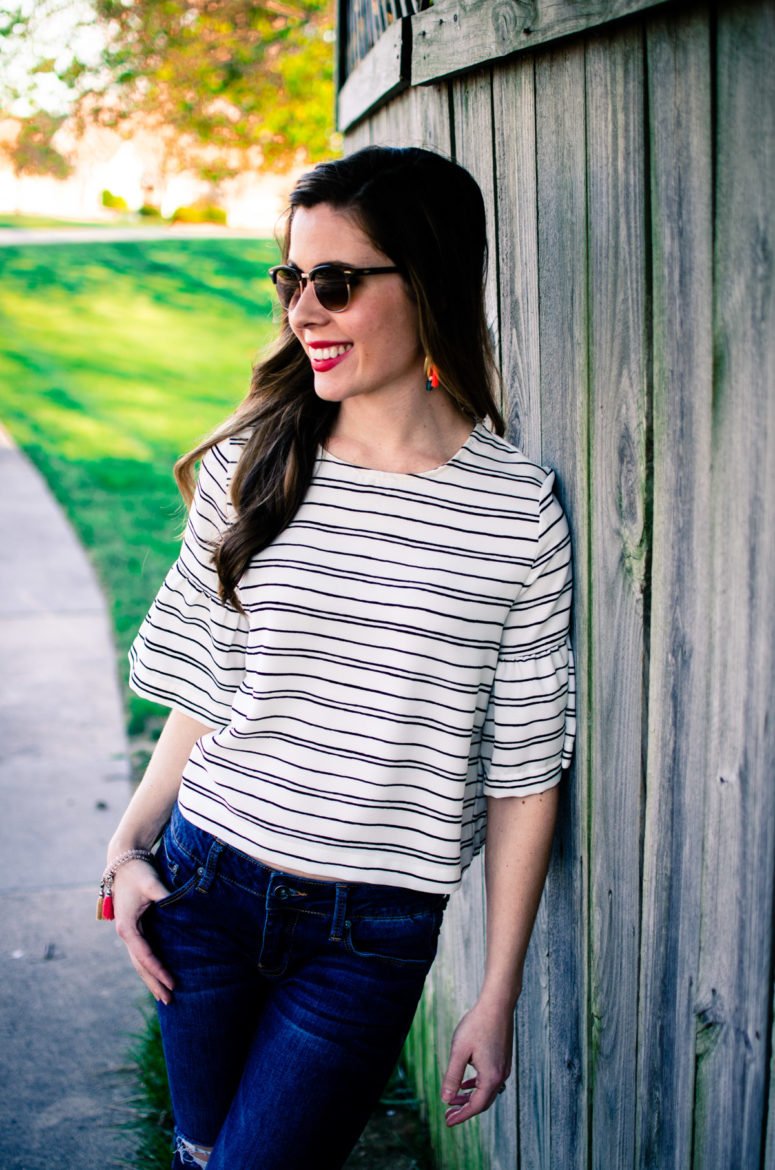 Cropped striped blouse from Who What Wear collection at Target with distressed denim and tassel jewelry. 