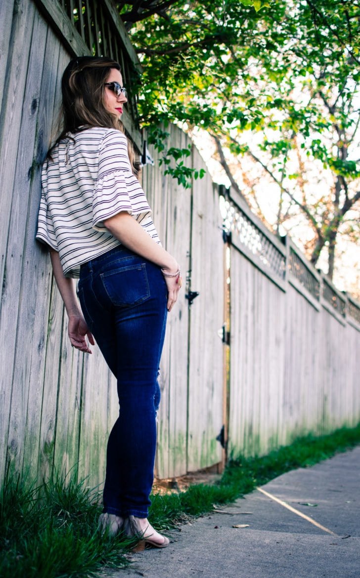 Cropped striped blouse from Who What Wear collection at Target with distressed denim and tassel jewelry. 