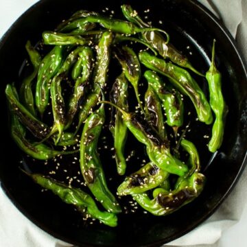 This recipe for Blistered Sesame Shishito Peppers is an easy snack or side dish that you can make in a snap! It's vegan, gluten free, and packed with flavor!