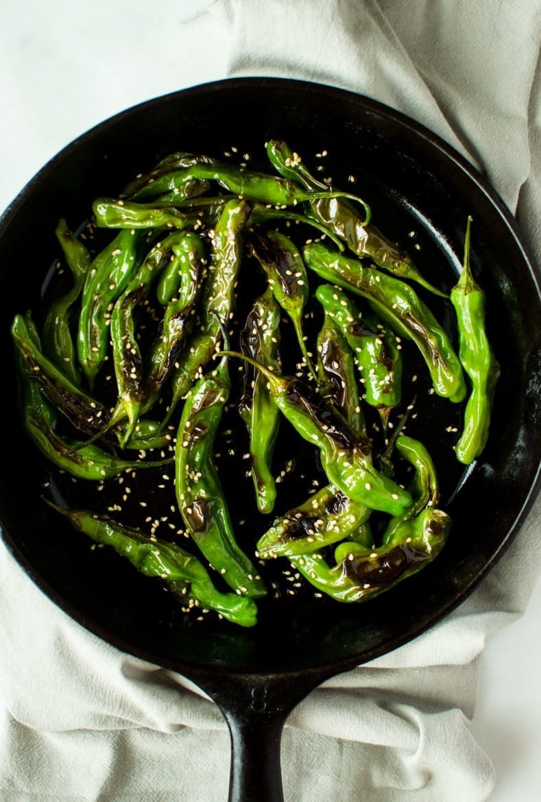 This recipe for Blistered Sesame Shishito Peppers is an easy snack or side dish that you can make in a snap! It's vegan, gluten free, and packed with flavor!