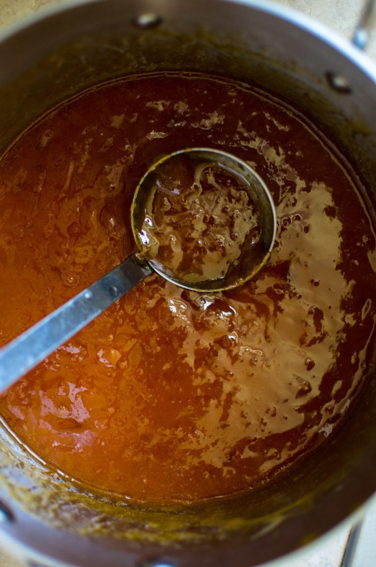 A pot of jam on the boil.