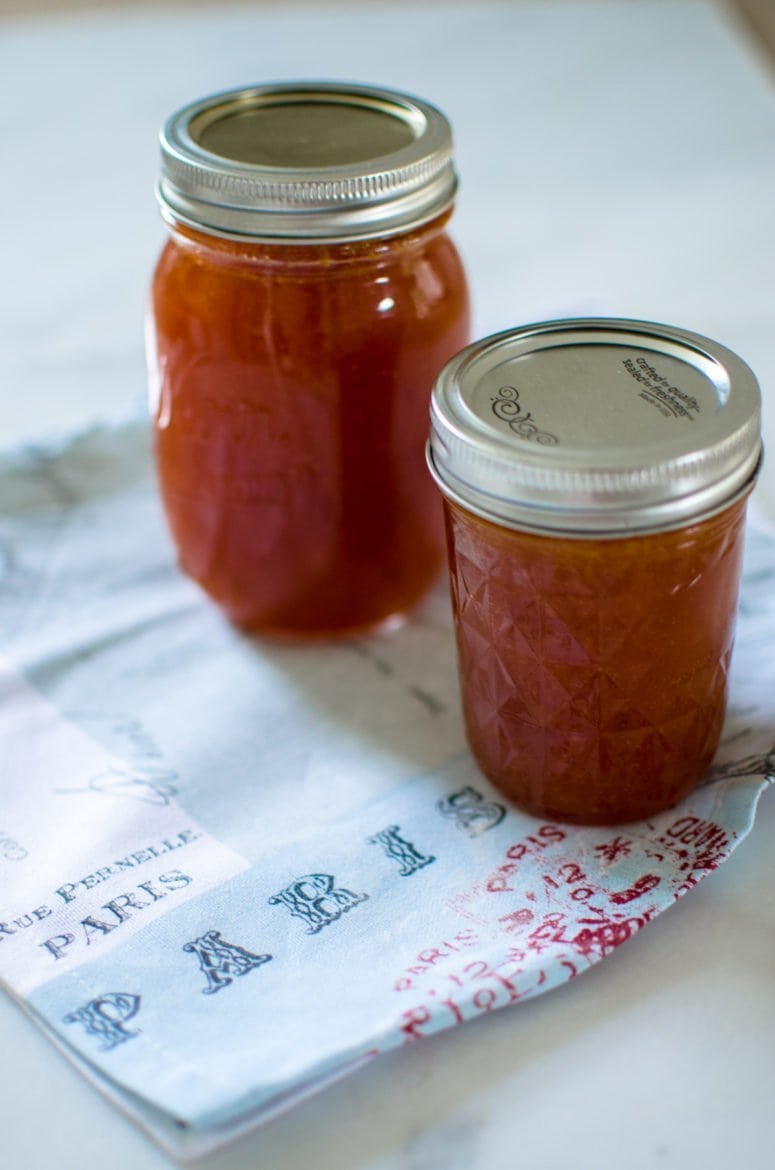 Two mason jars filled with apricot jam