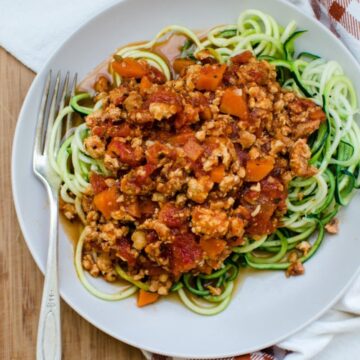 Zucchini Noodles with Chicken Bolognese is an easy, veggie-loaded recipe you can make on weeknights for a healthy and super-satisfying dinner that the family will love!