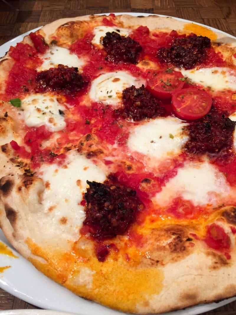 Authentic Neapolitan-style pizza at La Perla restaurant in Amsterdam