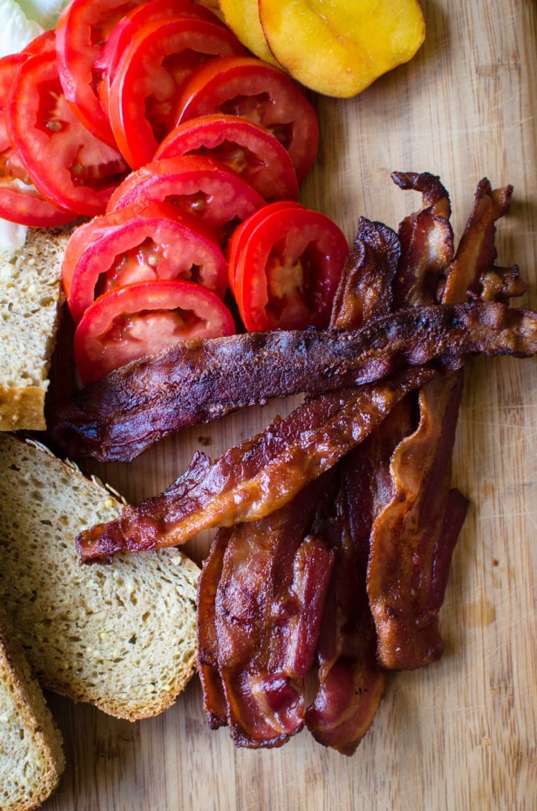 This recipe for the ultimate BLT sandwich features summer's finest tomatoes, lettuce, peaches, peach jam, and of course, BACON! You will love this flavorful twist on a Southern classic. #blt #bltsandwich #ultimatebltsandwich #bltrecipe