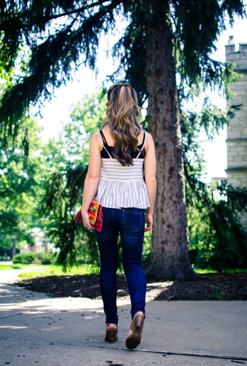 This laid back summer outfit idea feature a soft cotton Asos tank, distressed jeans and a colorful pom pom clutch!