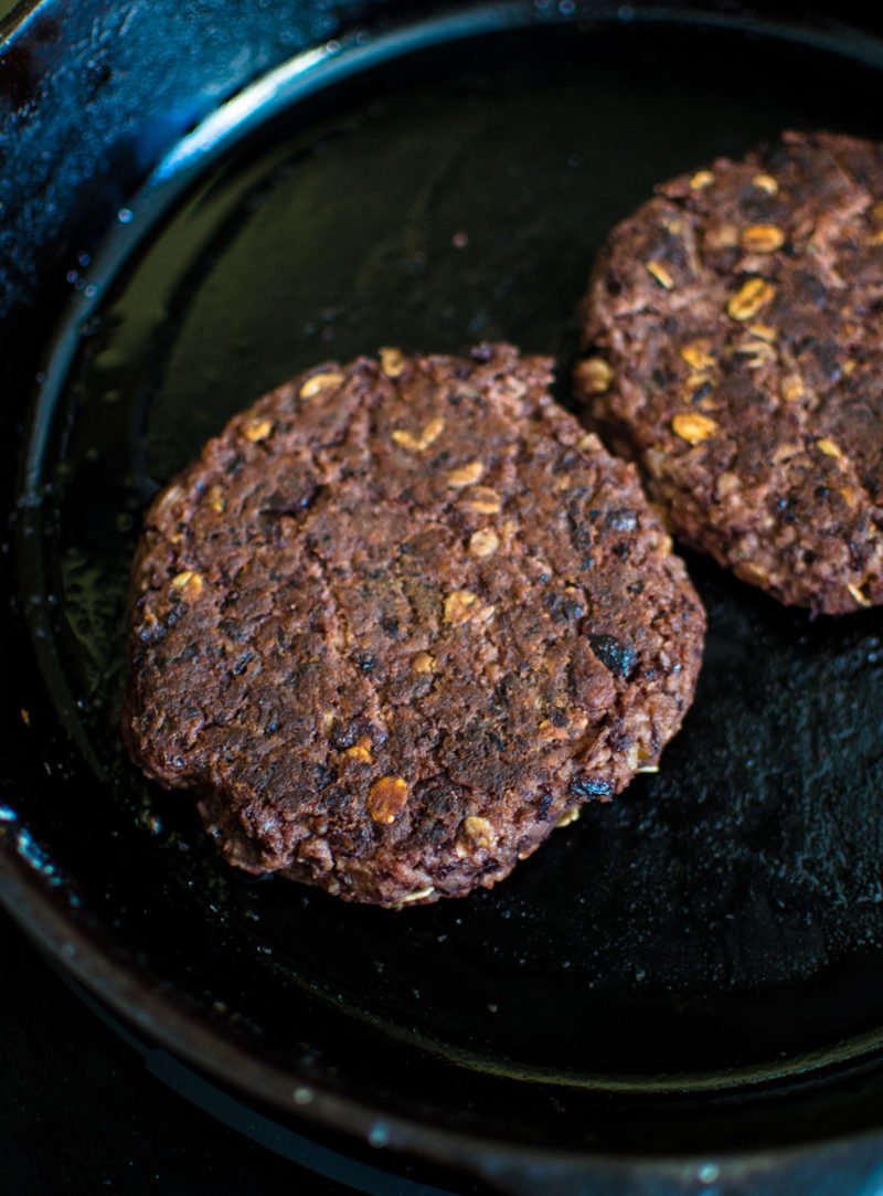 This vegetarian black bean burger recipe is the perfect option for game day. It's smothered in a Hatch chile quest and smoky BBQ sauce. 