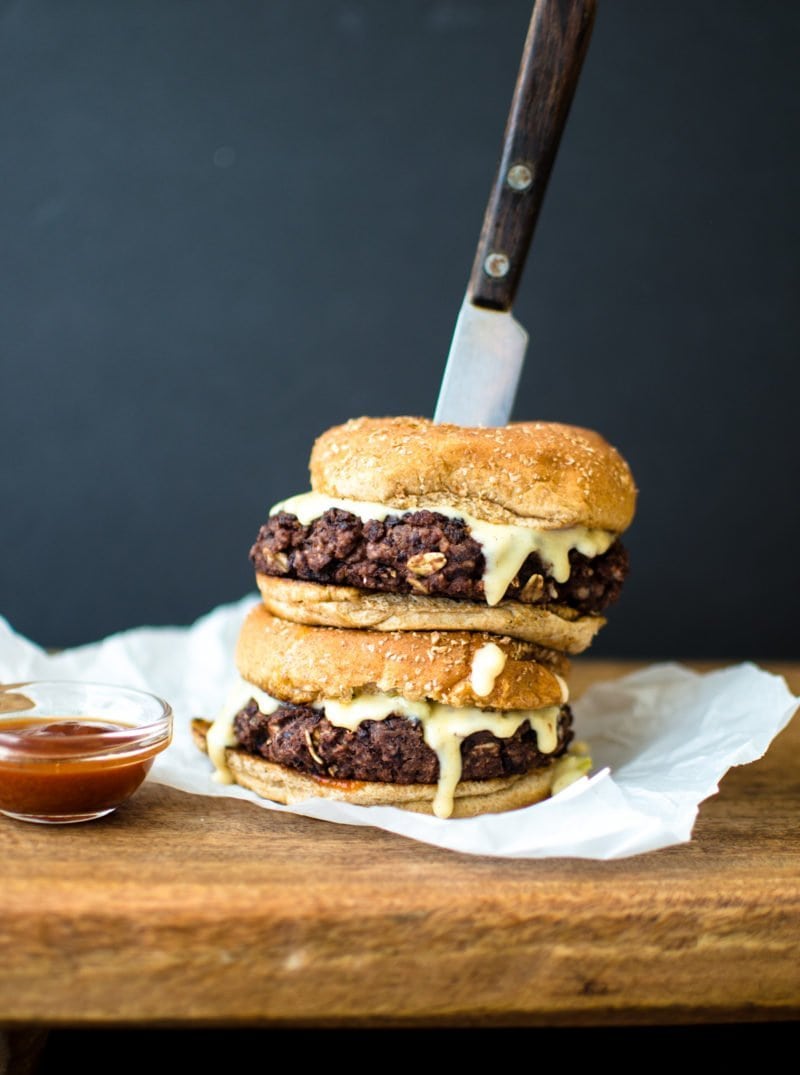 This vegetarian black bean burger recipe is the perfect option for game day. It's smothered in a Hatch chile quest and smoky BBQ sauce.