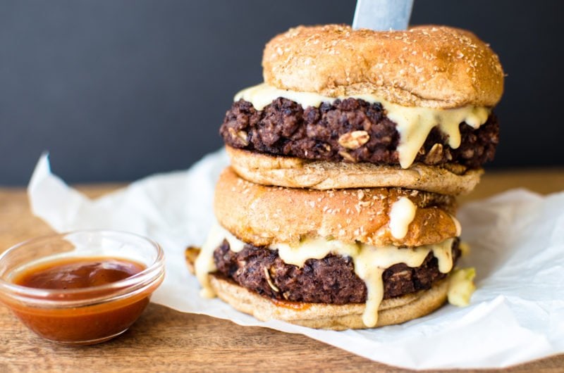 This vegetarian black bean burger recipe is the perfect option for game day. It's smothered in a Hatch chile quest and smoky BBQ sauce. 