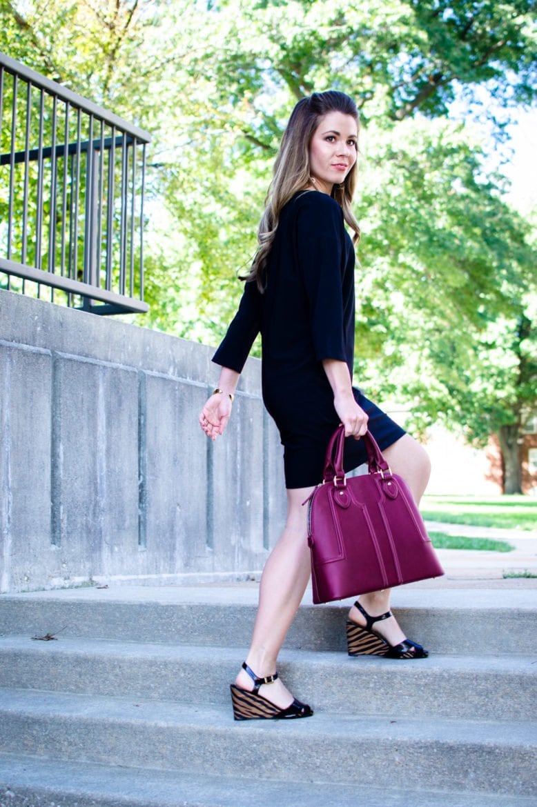 This edition of Sweet Chic features a dolman sleeve little black dress that's perfect for fall. It's paired with a wine-colored satchel bag and animal print wedges for a chic street-style outfit. 