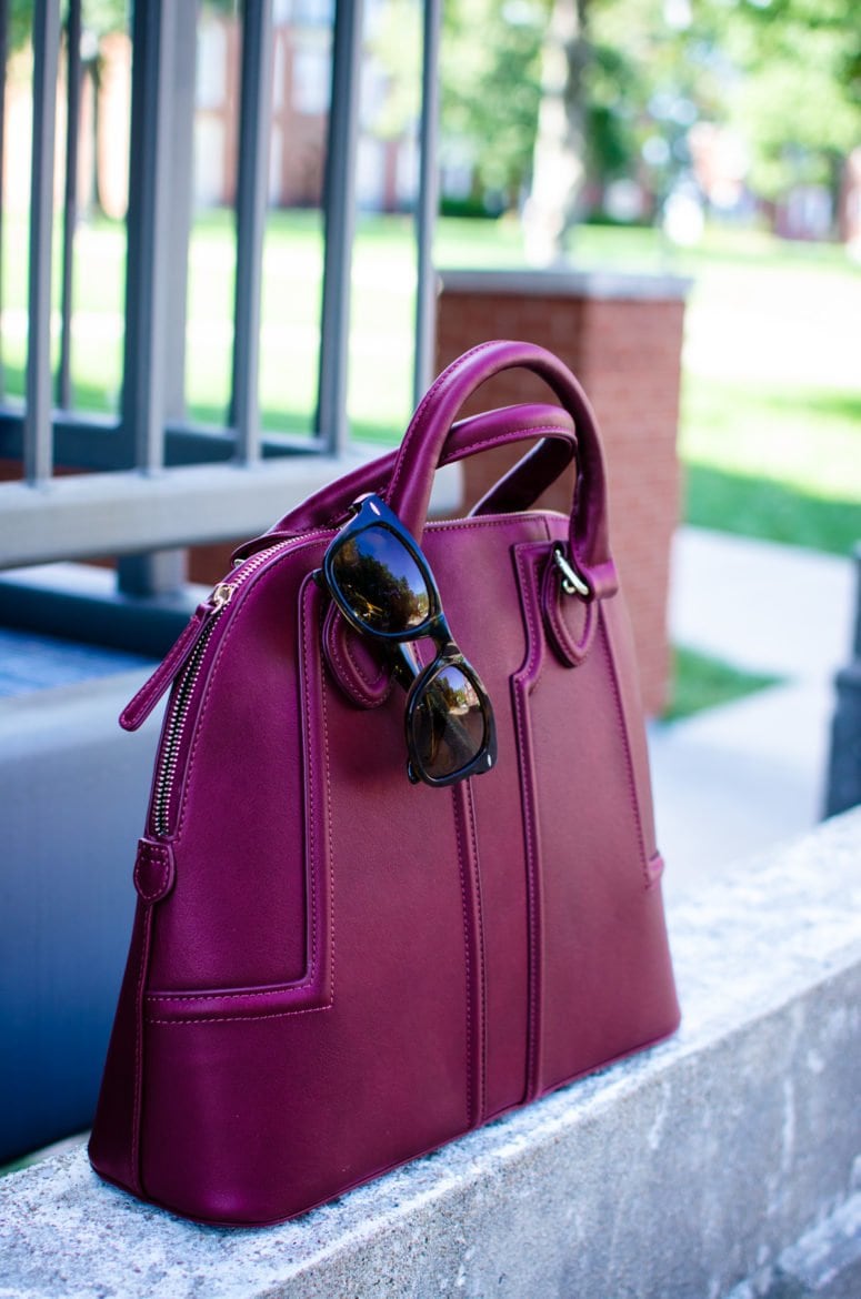 This edition of Sweet Chic features a dolman sleeve little black dress that's perfect for fall. It's paired with a wine-colored satchel bag and animal print wedges for a chic street-style outfit. 