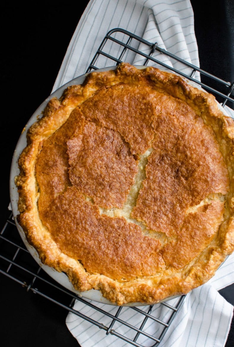 A chess pie on a cooling rack. 
