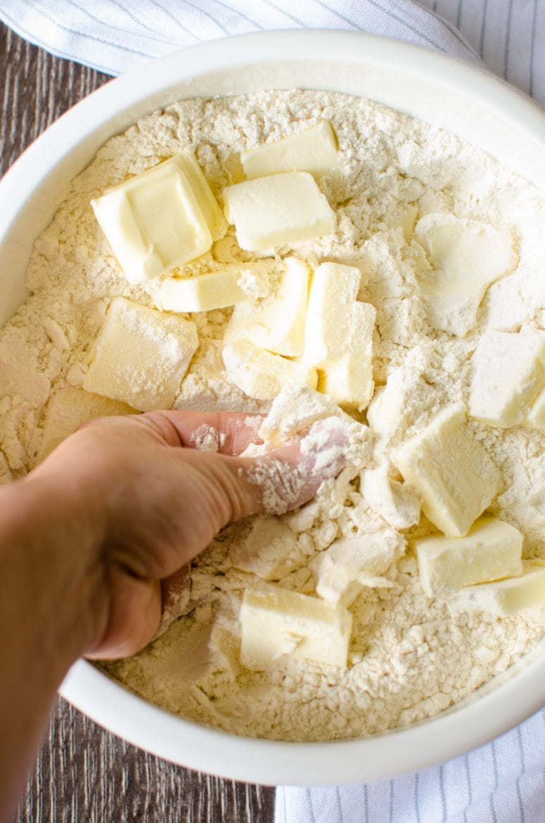 Butter being smashed into flour.