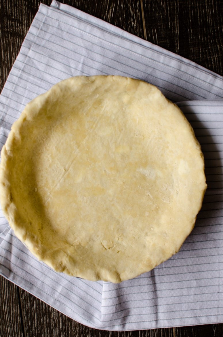 A bottom pie crust in a pie dish. 
