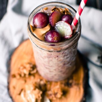 This recipe for overnight oats peanut butter and grape smoothie is prepped the night before so that you can easily prep a hearty smoothie in the morning that tastes like a PB&J!