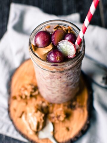 This recipe for overnight oats peanut butter and grape smoothie is prepped the night before so that you can easily prep a hearty smoothie in the morning that tastes like a PB&J!