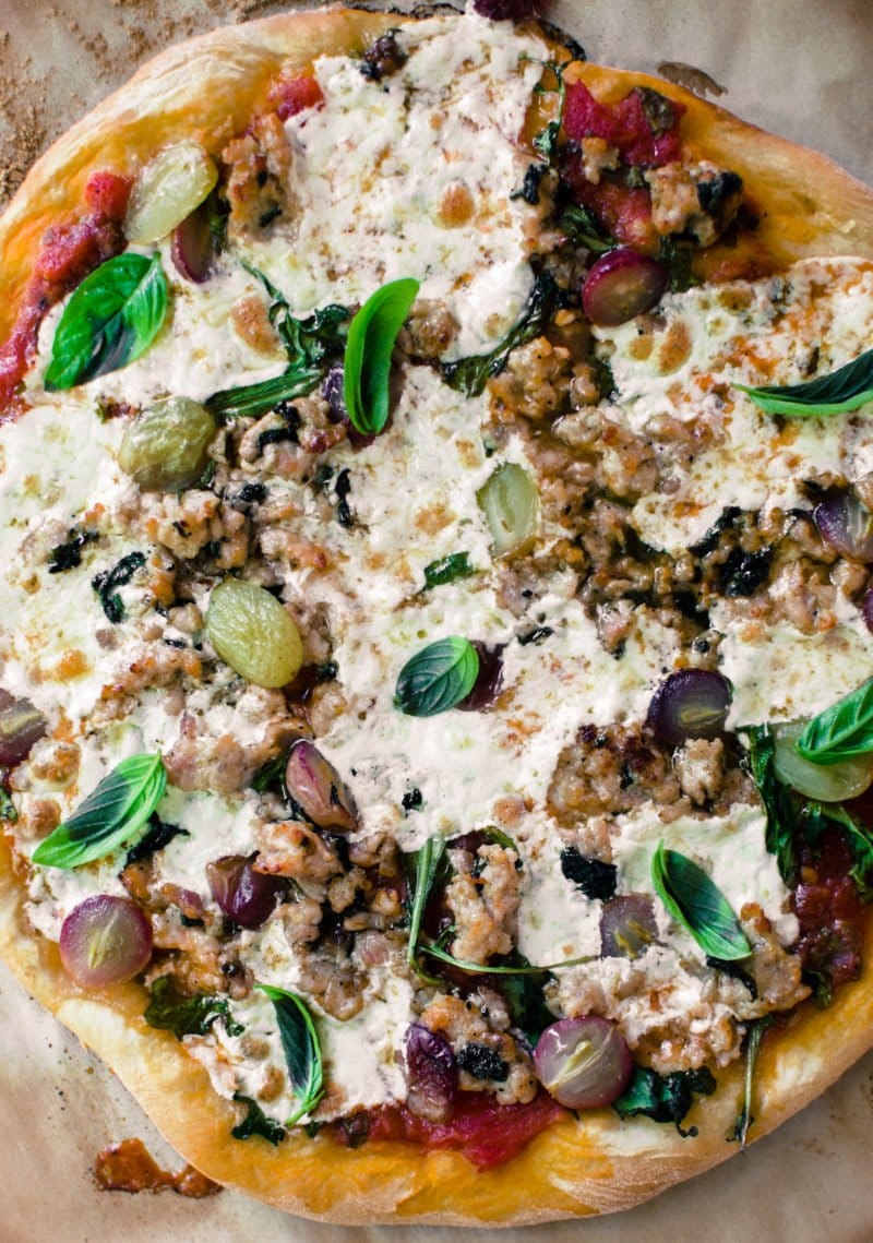 This rustic recipe for Roasted Grape and Chicken Sausage pizza is one of my favorite ways to top pizza during the fall and winter season!
