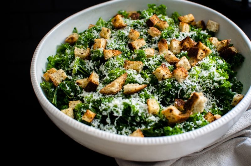 This simple kale salad is the perfect vehicle for creative toppings, homemade croutons, and can be used as a side dish or as sandwich filling!