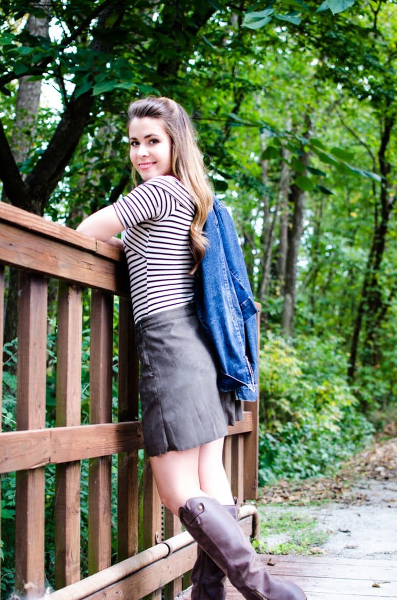 A fun fall weekend outfit is created with a high-waisted suede mini, an off-the shoulder striped body suit, and a denim jacket. 