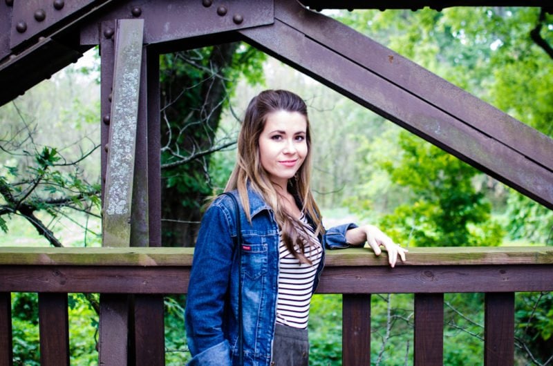 A fun fall weekend outfit is created with a high-waisted suede mini, an off-the shoulder striped body suit, and a denim jacket. 