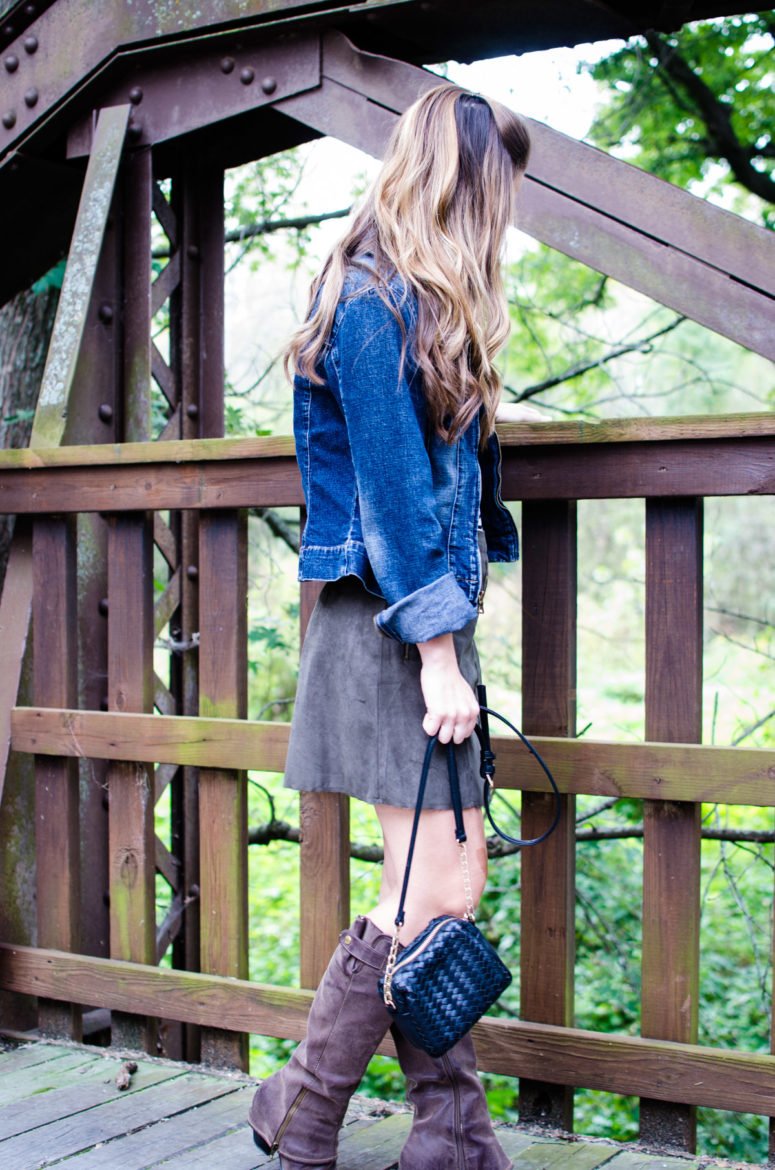 A fun fall weekend outfit is created with a high-waisted suede mini, an off-the shoulder striped body suit, and a denim jacket. 