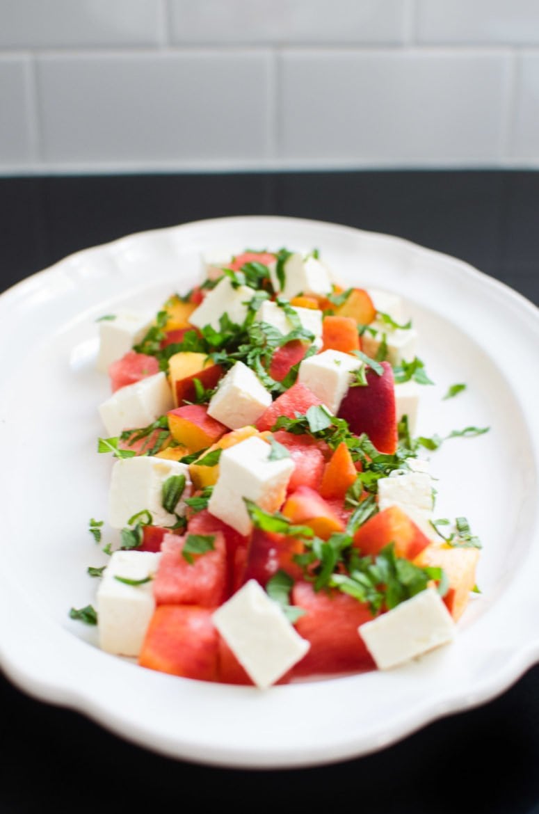 Watermelon peach salad on a serving tray.