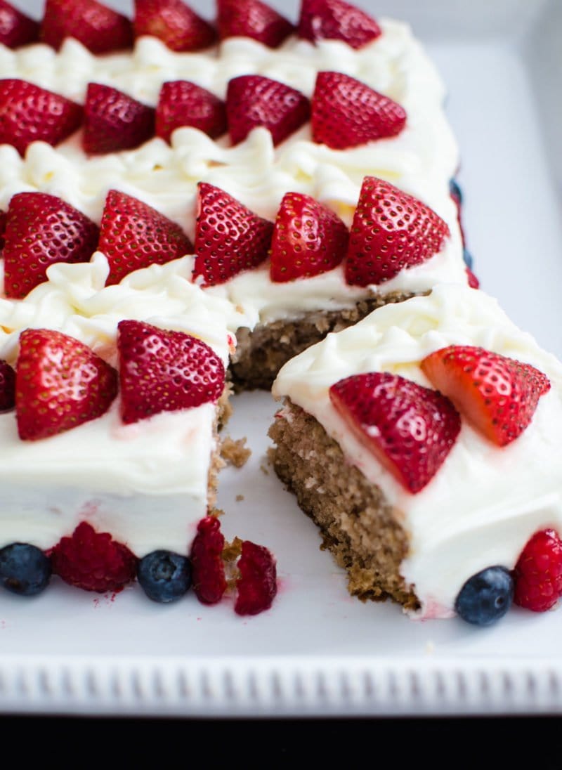 Berry flag cake with a slice cut. 