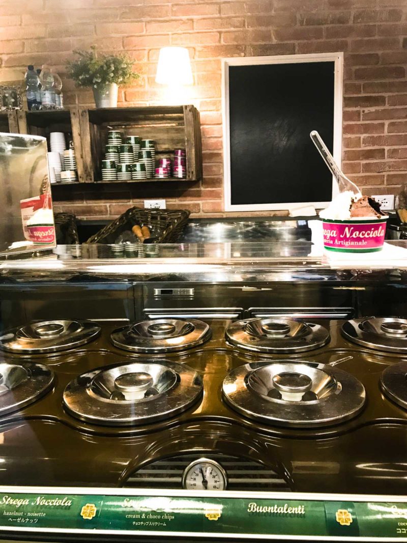 The proper gelato holding containers in a legit gelato shop.