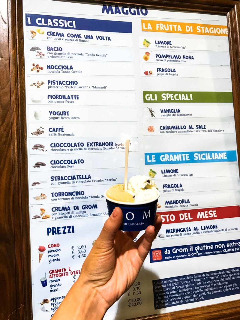 Gelato in front of a gelato menu.